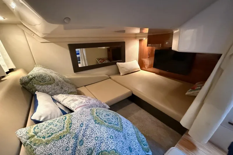 Slide: The Image of Interior of 2012 Regal 35 Sport Coupe with cozy seating and decorative pillows. - 24