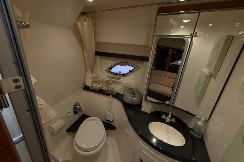 Slide: The Image of Luxurious bathroom in 2012 Regal 35 Sport Coupe yacht with modern amenities. - 25