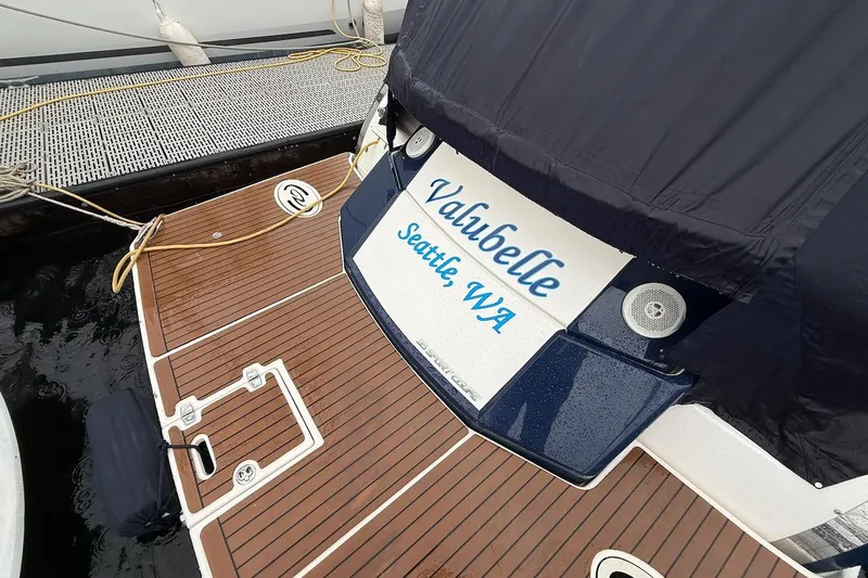 Slide: The Image of 2012 Regal 35 Sport Coupe docked, featuring teak deck and "Valubelle" nameplate, Seattle, WA. - 32