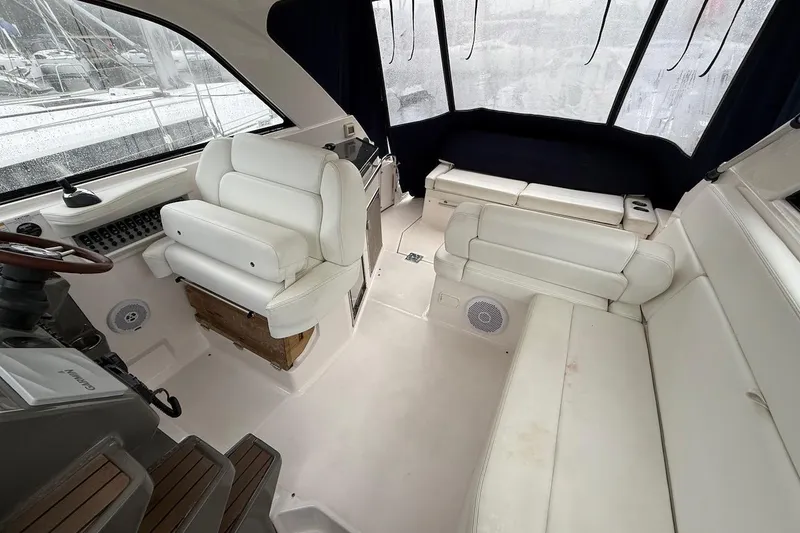 Slide: The Image of Interior of a 2012 Regal 35 Sport Coupe with white leather seating and helm. - 5