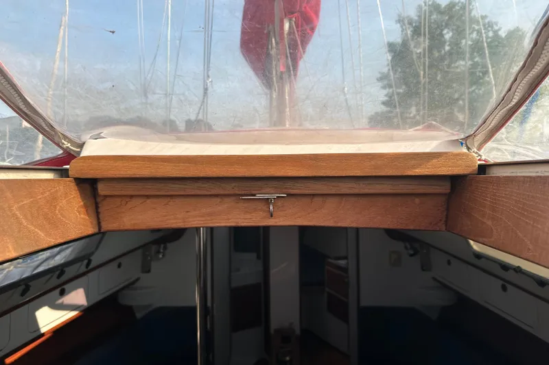 Slide: The Image of Interior view of a 1992 J Boats J/35 sailboat with wooden hatch and clear canopy. - 8
