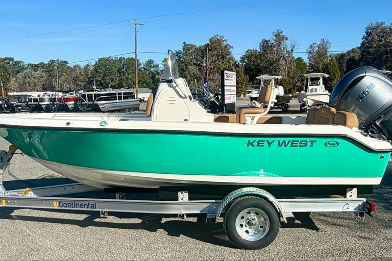 The Image of 2026 Key West 189 FS boat on trailer, vibrant green hull, outdoor display. - 0