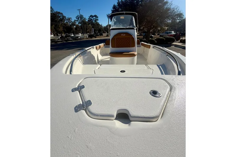 Slide: The Image of 2026 Key West 189 FS boat interior with seating and storage compartments. - 10