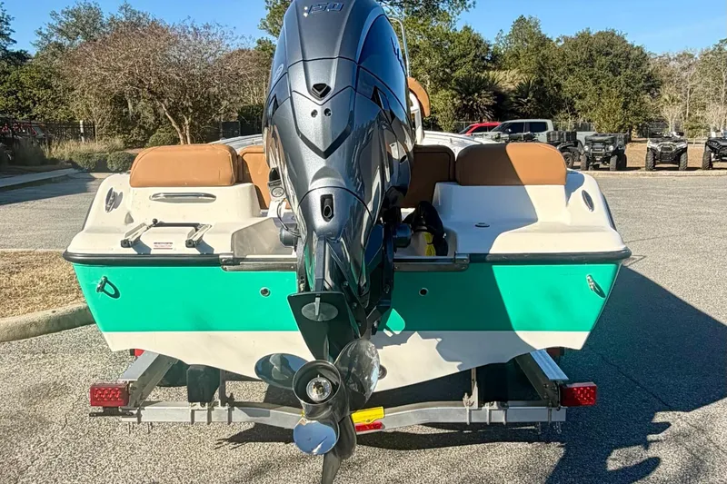 Slide: The Image of 2026 Key West 189 FS boat with outboard motor on trailer, parked outdoors. - 6