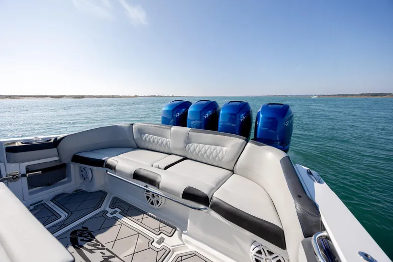 Slide: The Image of 2020 Nor-Tech 390 Sport Center Console boat with luxurious seating and powerful engines. - 11