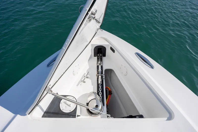 Slide: The Image of 2020 Nor-Tech 390 Sport Center Console anchor compartment, open on calm water. - 15