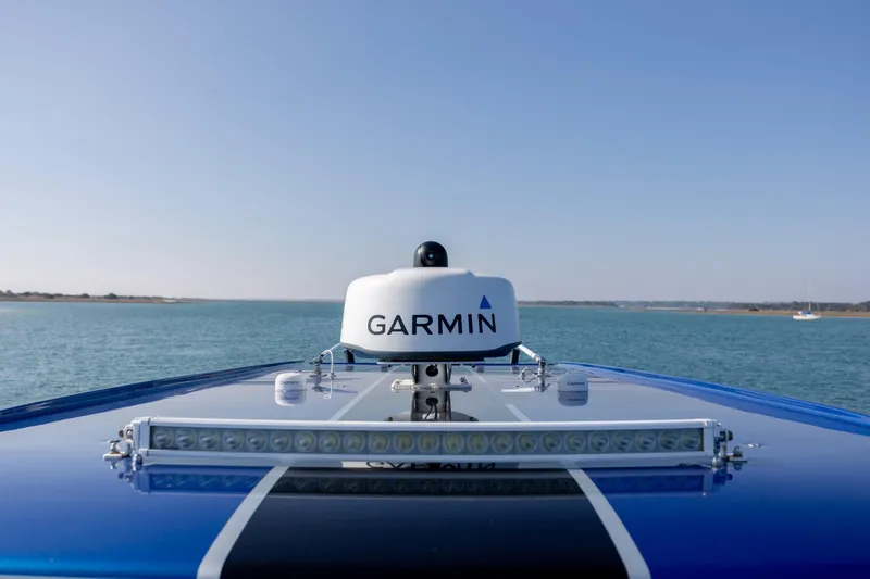 Slide: The Image of 2020 Nor-Tech 390 Sport Center Console with Garmin equipment on open water. - 18