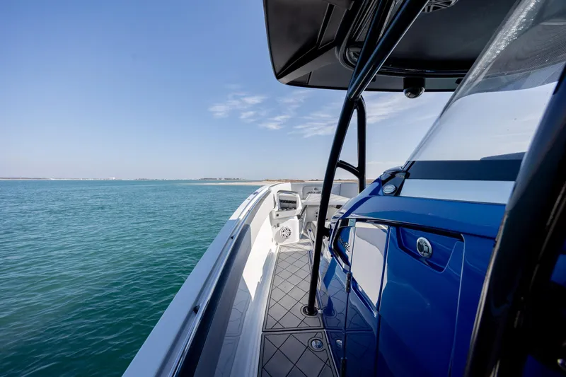 Slide: The Image of 2020 Nor-Tech 390 Sport Center Console on calm blue waters. - 19