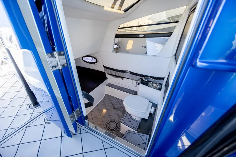 Slide: The Image of 2020 Nor-Tech 390 Sport Center Console interior with modern bathroom amenities. - 20