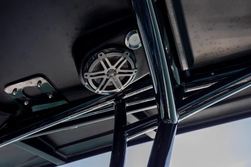 Slide: The Image of Close-up of 2020 Nor-Tech 390 Sport Center Console's speaker and framework. - 29