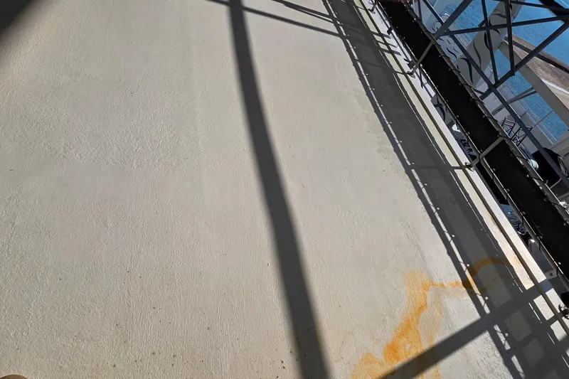 Slide: The Image of 1999 Stardust Cruisers 16x60 deck with shadows and rust stain. - 17