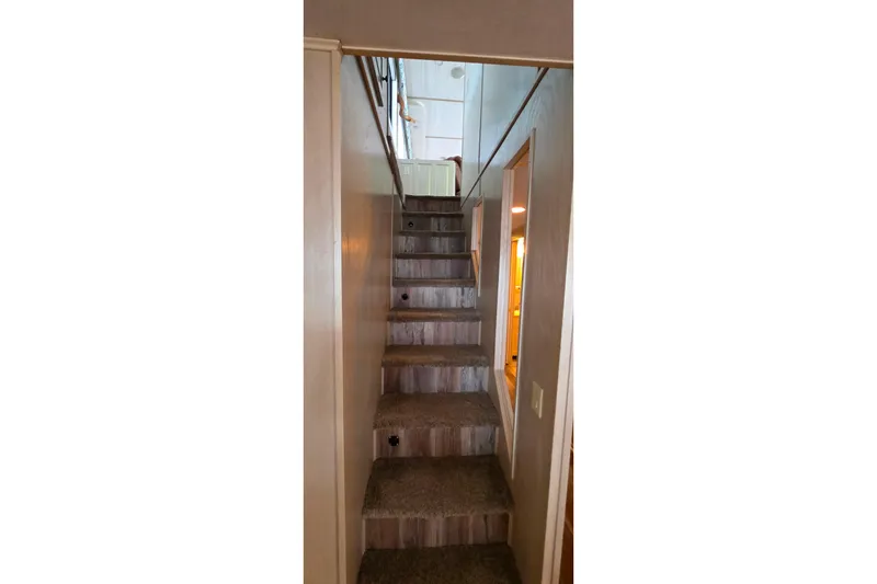 Slide: The Image of Staircase inside 1999 Stardust Cruisers 16x60 houseboat, leading to upper deck. - 34