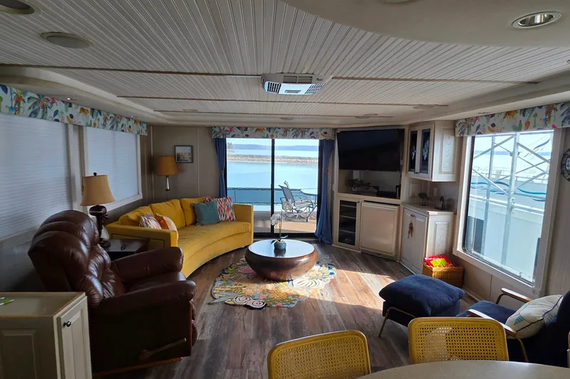 Slide: The Image of Cozy interior of 1999 Stardust Cruisers 16x60 houseboat with lake view and modern furnishings. - 37