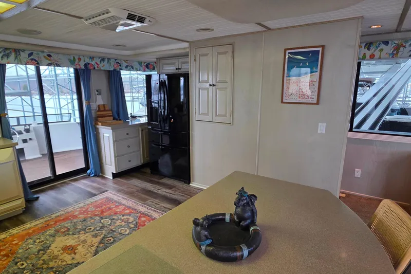 Slide: The Image of Interior of 1999 Stardust Cruisers 16x60 houseboat with modern kitchen and decor. - 48