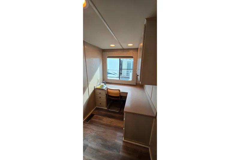 Slide: The Image of Interior of 1999 Stardust Cruisers 16x60 houseboat with desk and window view. - 50