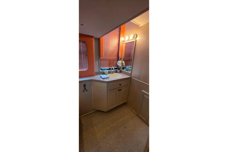 Slide: The Image of Bathroom interior of 1999 Stardust Cruisers 16x60 houseboat with sink and mirror. - 52