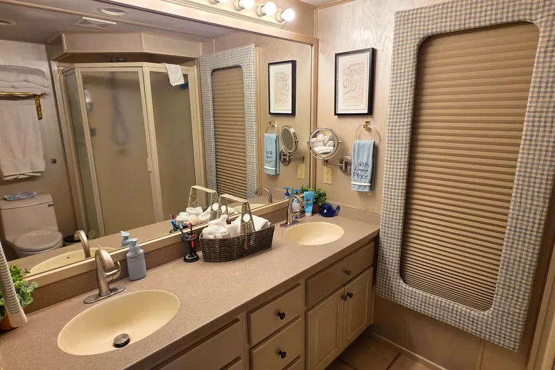 Slide: The Image of Bathroom interior of 1999 Stardust Cruisers 16x60 houseboat with dual sinks and shower. - 59