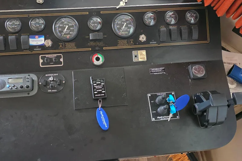 Slide: The Image of Control panel of a 1999 Stardust Cruisers 16x60 houseboat with gauges and switches. - 65