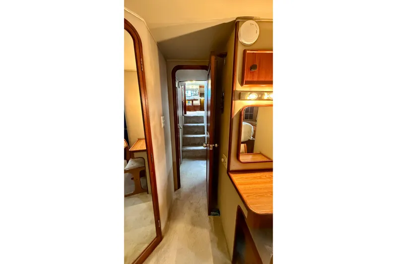 Slide: The Image of Interior hallway of 1987 Chris-Craft 500 Constellation yacht with wooden accents and mirror. - 18