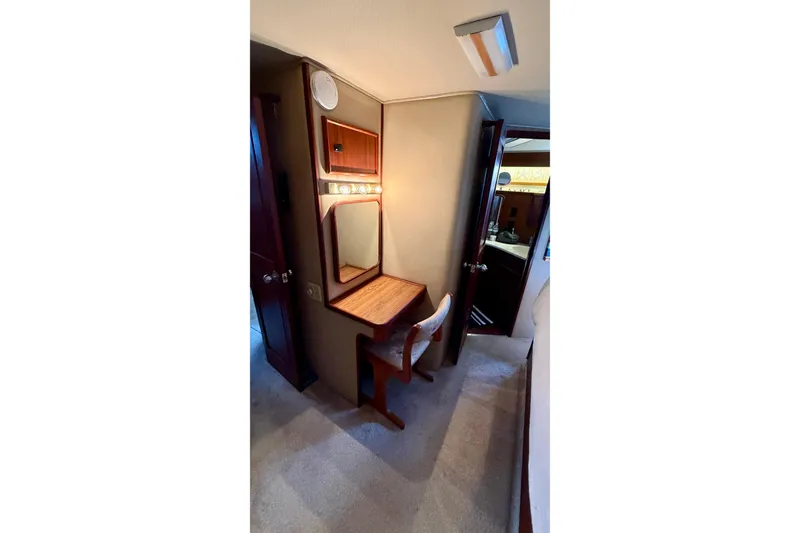 Slide: The Image of 1987 Chris-Craft 500 Constellation yacht interior with vanity and chair. - 19