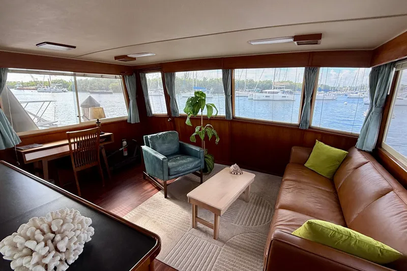 Slide: The Image of Interior of 1987 Chris-Craft 500 Constellation yacht with elegant seating and waterfront view. - 32