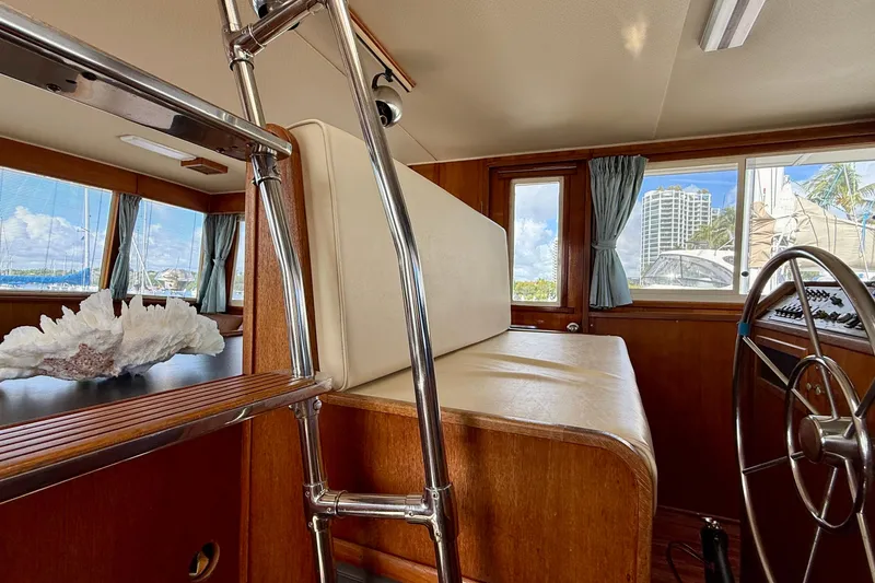 Slide: The Image of 1987 Chris-Craft 500 Constellation yacht interior with helm, seating, and large windows. - 37