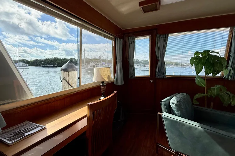 Slide: The Image of Interior of 1987 Chris-Craft 500 Constellation yacht with marina view through large windows. - 39