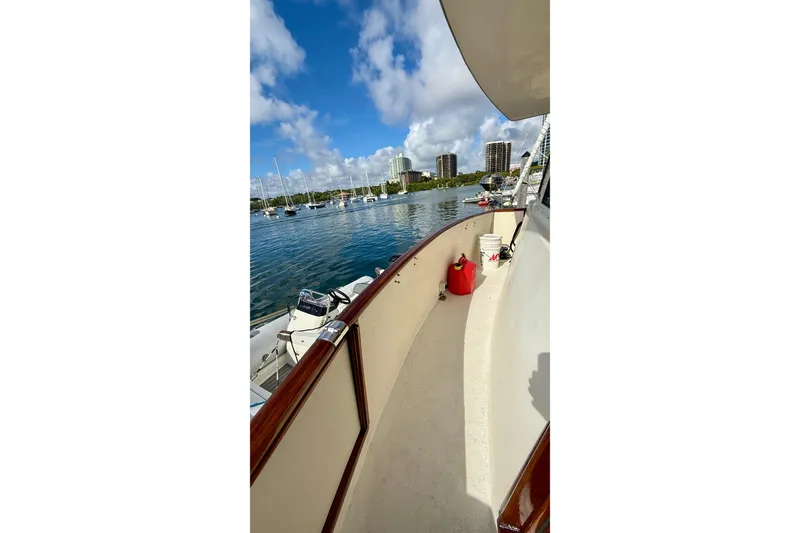 Slide: The Image of 1987 Chris-Craft 500 Constellation yacht deck with marina view and clear skies. - 42