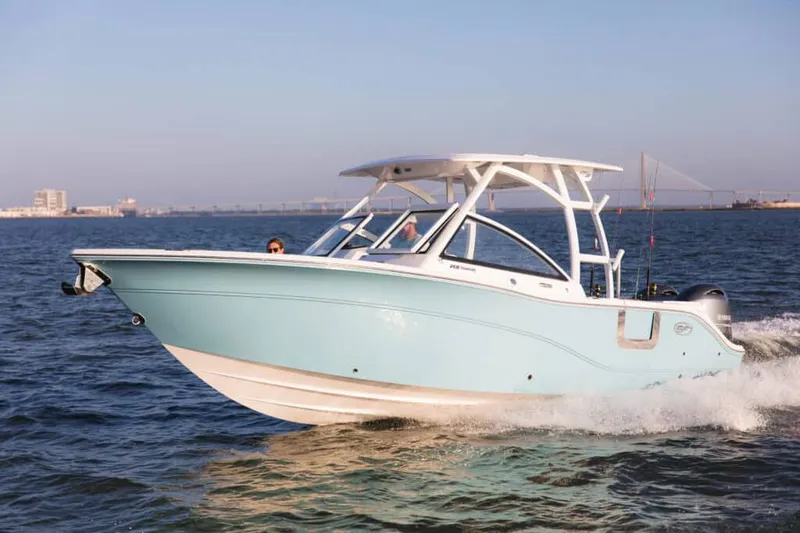 Slide: The Image of 2026 Sea Fox 268 Traveler boat displayed indoors at a boat show. - 2