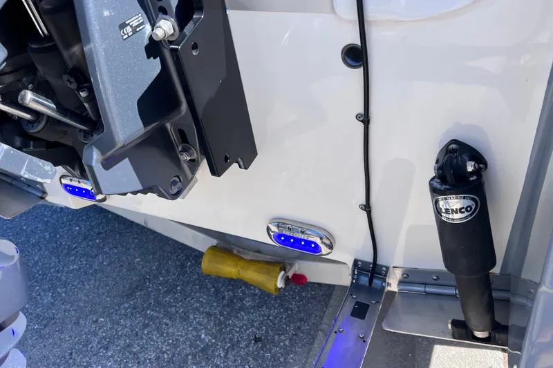 Slide: The Image of 2021 NauticStar 227 XTS boat stern with Lenco trim tab and underwater LED lights. - 10