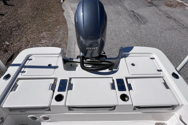 Slide: The Image of 2021 NauticStar 227 XTS boat with powerful 200 HP outboard motor. - 23