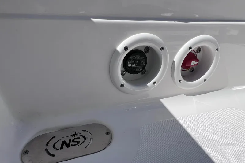Slide: The Image of 2021 NauticStar 227 XTS boat detail with control panel and NS logo. - 28