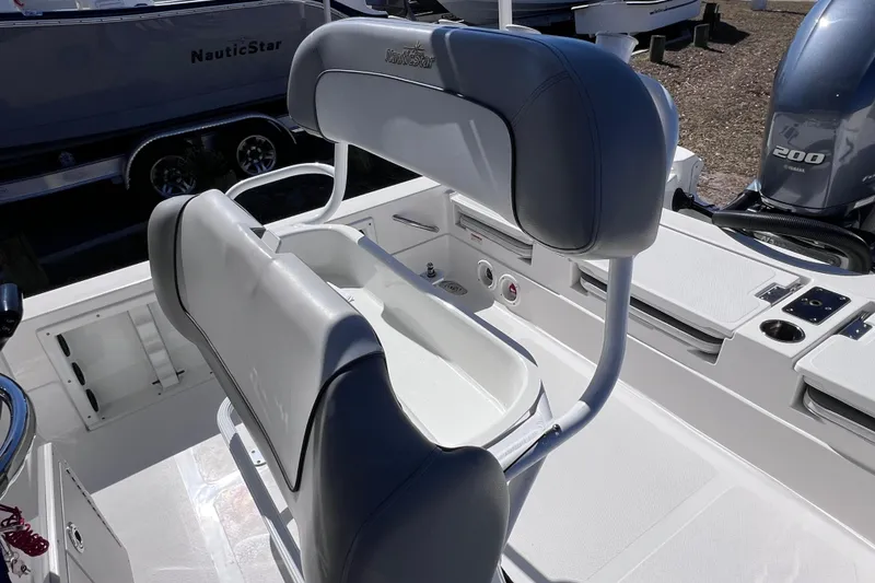 Slide: The Image of 2021 NauticStar 227 XTS boat interior with seating and console details. - 30