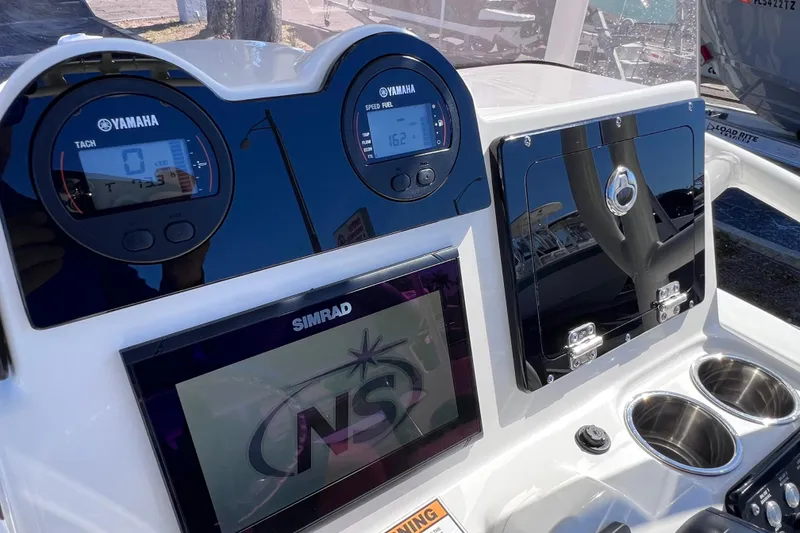 Slide: The Image of 2021 NauticStar 227 XTS boat dashboard with Yamaha gauges and Simrad display. - 33