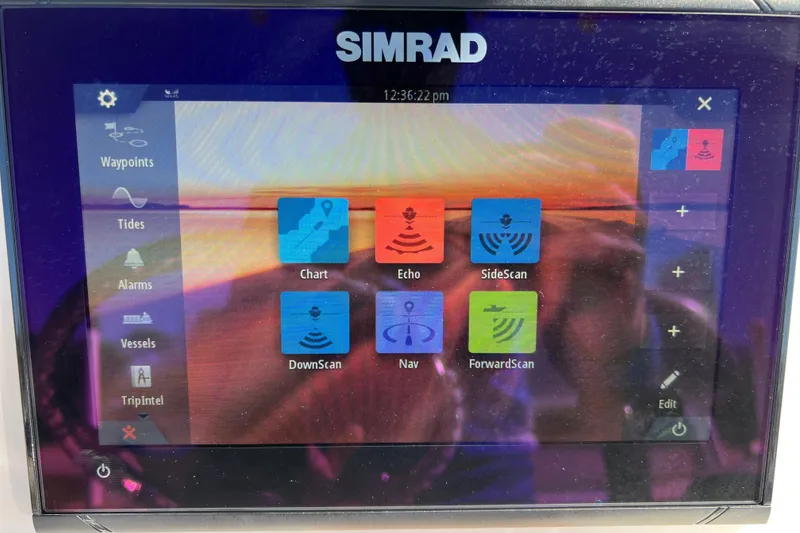 Slide: The Image of Simrad display on 2021 NauticStar 227 XTS showing navigation and sonar options. - 38