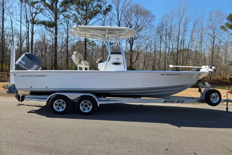 The Image of 2019 Sportsman Masters 247 Bay Boat on trailer, parked outdoors. - 0