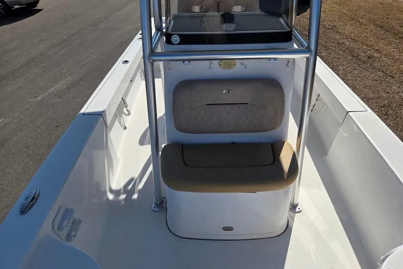 Slide: The Image of 2019 Sportsman Masters 247 Bay Boat interior with seating and console view. - 10
