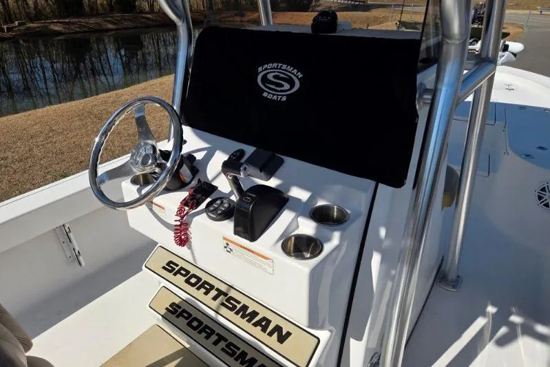 Slide: The Image of 2019 Sportsman Masters 247 Bay Boat console with steering wheel and controls. - 12