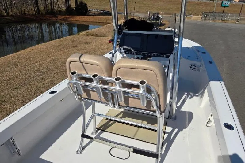 Slide: The Image of 2019 Sportsman Masters 247 Bay Boat interior with dual seats and control panel. - 14