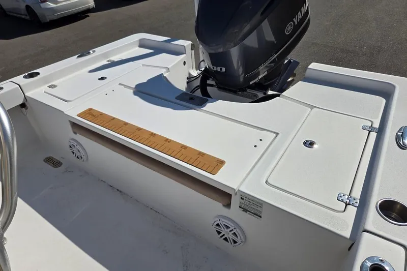 Slide: The Image of 2019 Sportsman Masters 247 Bay Boat with Yamaha engine, featuring a spacious deck and storage compartments. - 15