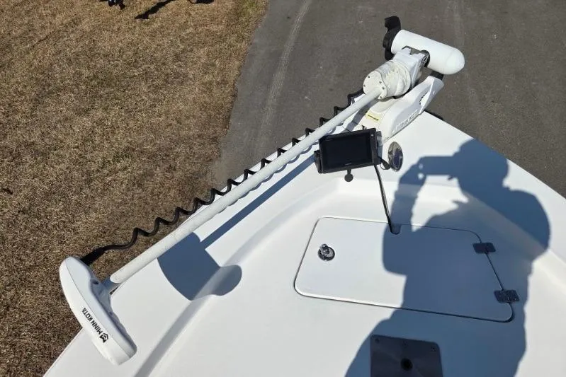 Slide: The Image of 2019 Sportsman Masters 247 Bay Boat with trolling motor and control panel. - 8