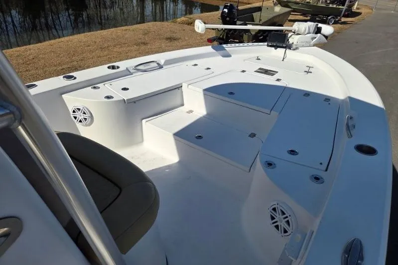 Slide: The Image of 2019 Sportsman Masters 247 Bay Boat interior with seating and storage compartments. - 9