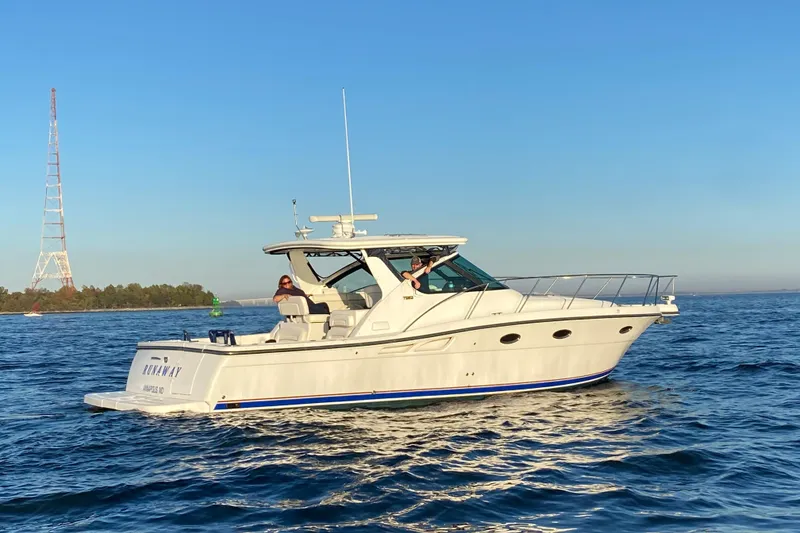 The Image of 2005 Tiara Yachts 3600 Open cruising on calm waters under clear blue skies. - 0