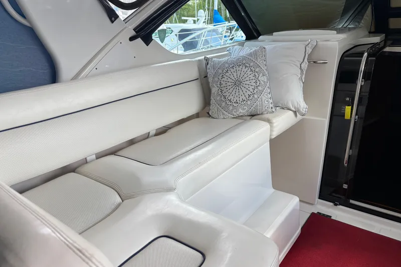 Slide: The Image of Luxurious interior seating of 2005 Tiara Yachts 3600 Open with decorative pillows. - 11