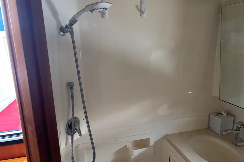 Slide: The Image of 2005 Tiara Yachts 3600 Open bathroom with shower and sink. - 19