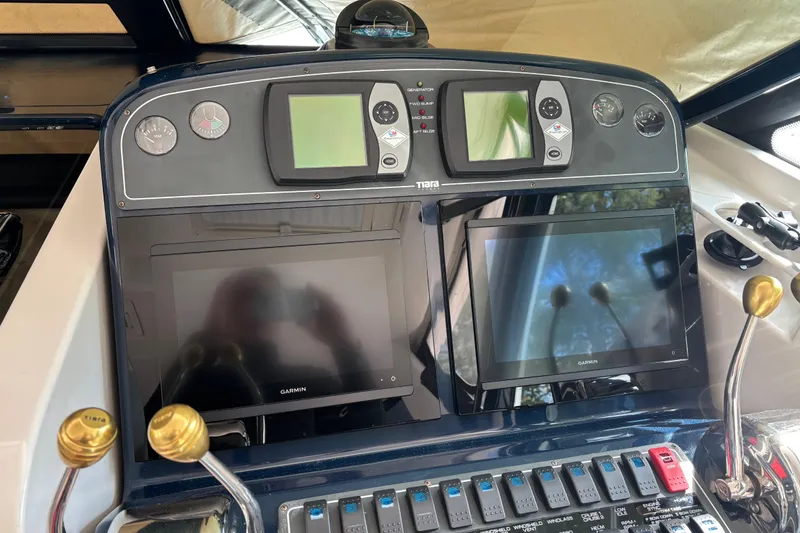 Slide: The Image of Dashboard of a 2005 Tiara Yachts 3600 Open with Garmin navigation displays. - 20