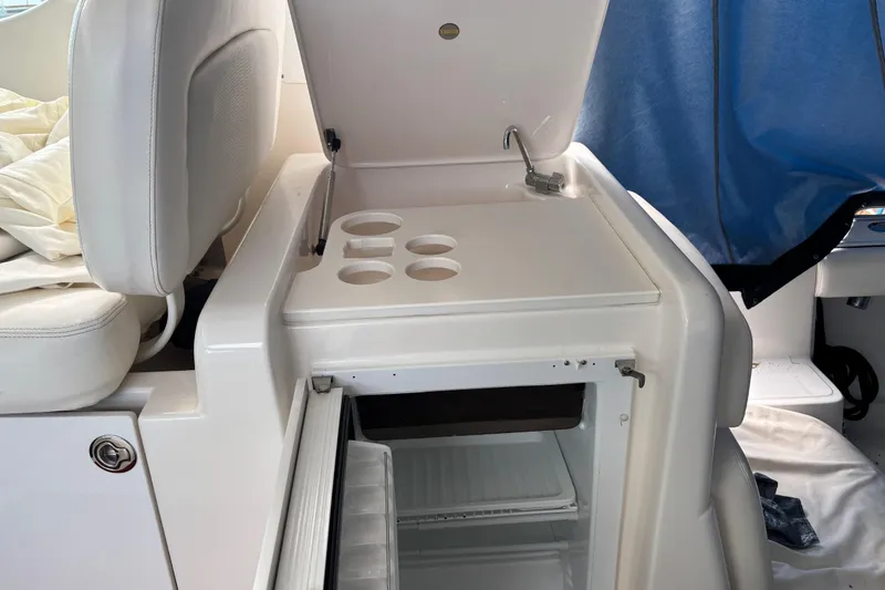 Slide: The Image of 2005 Tiara Yachts 3600 Open interior with open fridge and cup holders. - 23