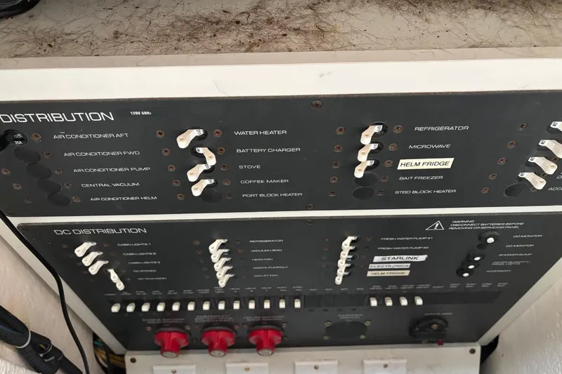 Slide: The Image of Electrical panel of a 2005 Tiara Yachts 3600 Open, showing distribution switches. - 25