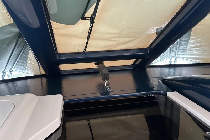 Slide: The Image of Interior view of a 2005 Tiara Yachts 3600 Open, showcasing the cabin roof and window. - 26