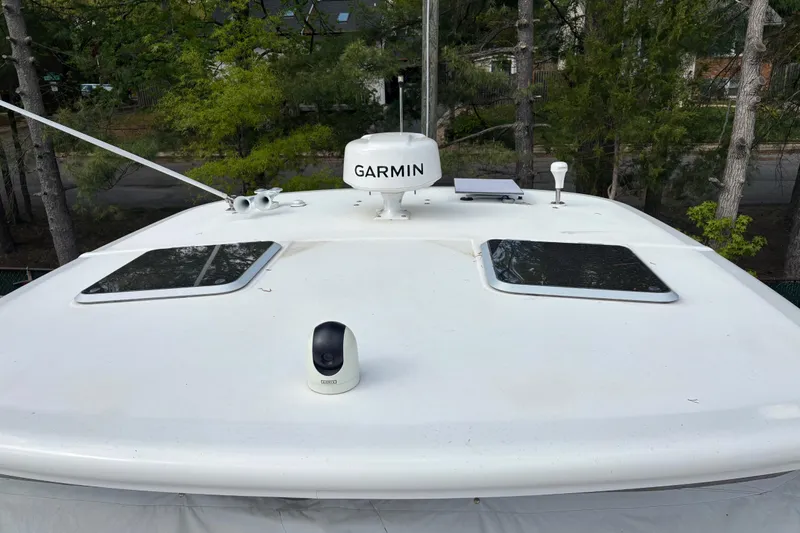 Slide: The Image of Tiara Yachts 3600 Open 2005 boat roof with Garmin equipment, surrounded by trees. - 31